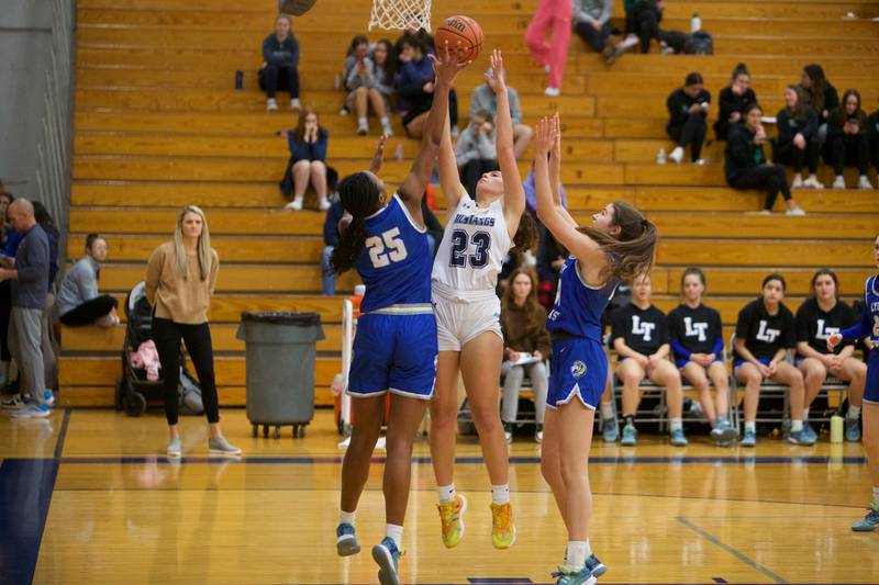 Downers Grove South's Addison Bryant's shot is blocked by Lyons Nora Ezike at the West Suburban Conference Crossover Championship on Wednesday, Feb.8,2023 in Addison.