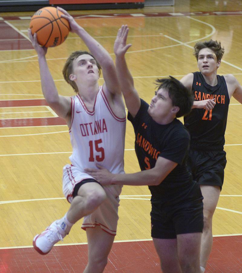 Ottawa’s Blake Schmitz works to drive past Sandwich’s Griffin Somolock in the 1st period Tuesday at Ottawa.