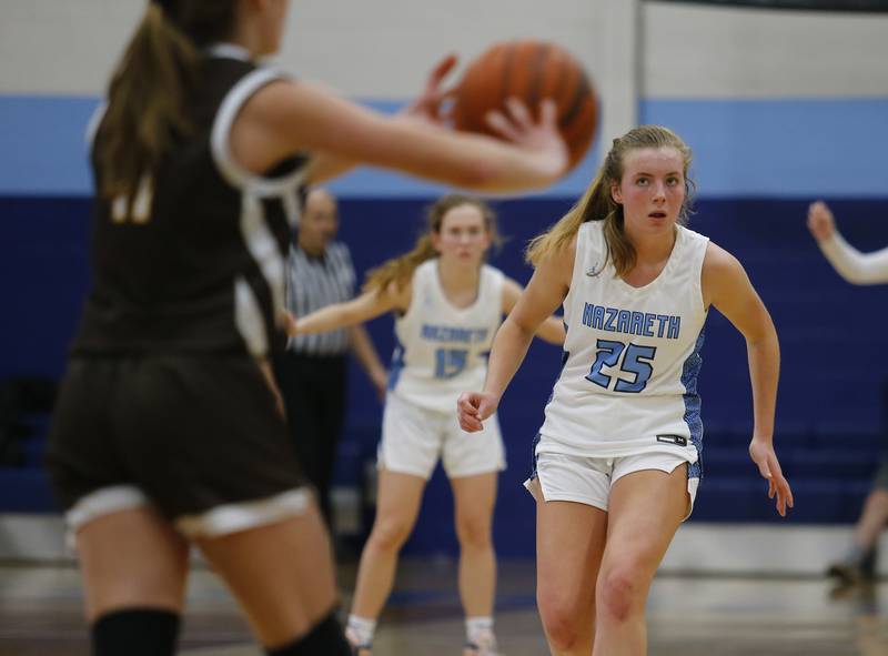 Nazareth's Amalia Dray (25) waits back on defense during the girls varsity basketball game between Carmel High School and Nazareth Academy on Wednesday, Dec. 7, 2022 in LaGrange, IL.