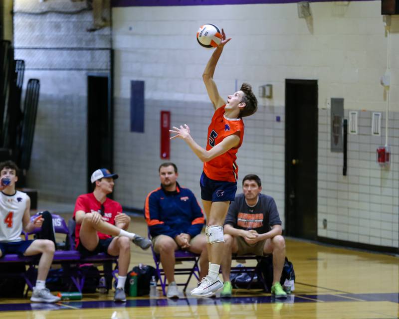 Oswego's Alex Rosenow (5) serves during Downers Grove North Regional final match between Oswego at Downers Grove North. May26, 2022.