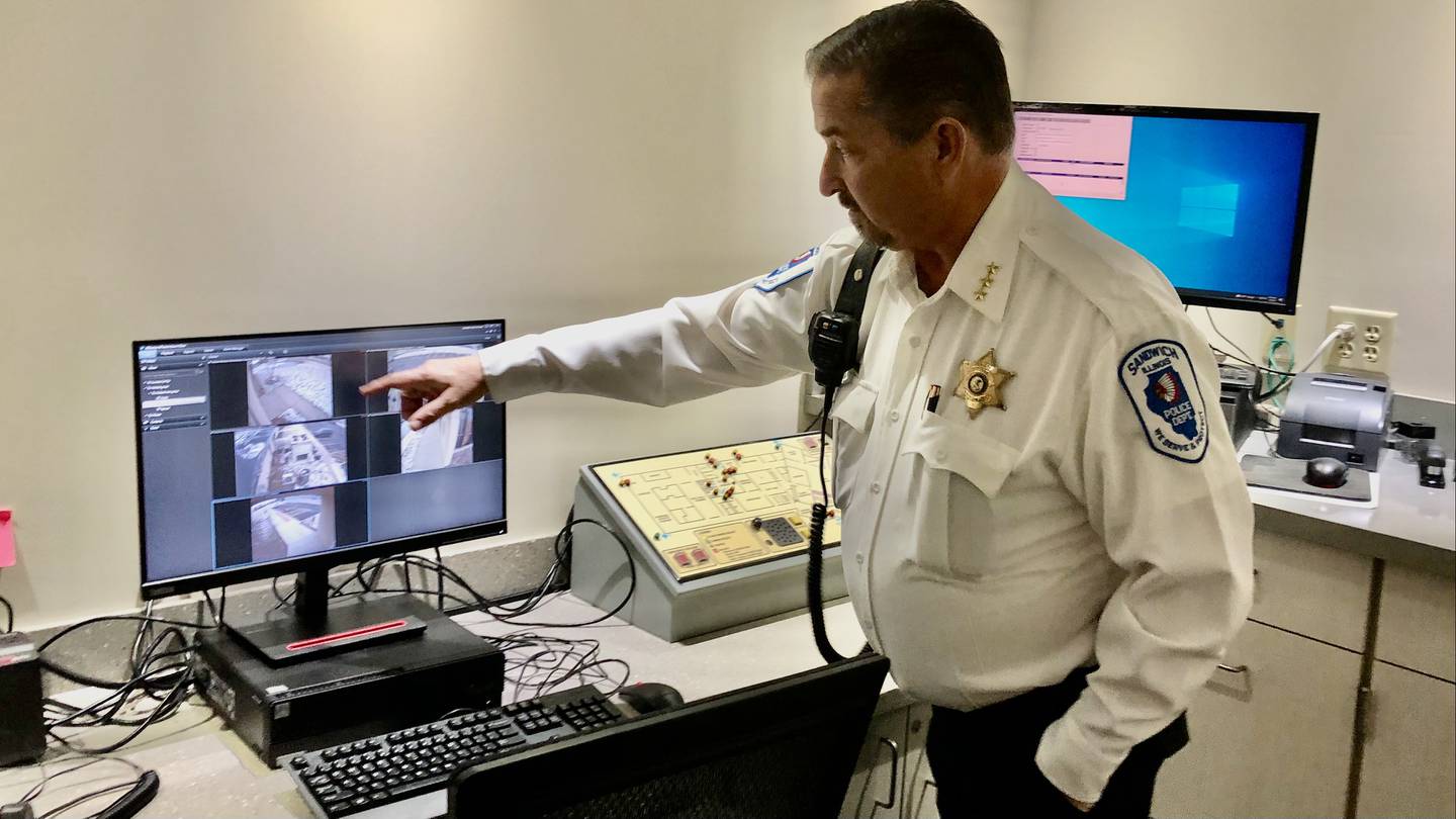 Sandwich Police Chief James Bianchi demonstrating the new security monitoring capabilities equipped at the new police department at 1251 E. Sixth St. in Sandwich.