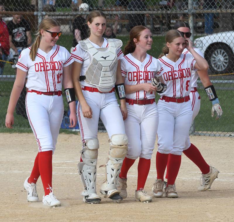 Oregon's Izzy Berg, Kendall Boyle, Ashlee Mundell, and Kylie Morrow walk back to their dugout after beating Somonauk 6-0 at the 2A Oregon Regional on Wednesday, May 20, 2026.