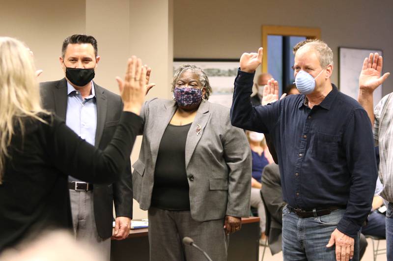 Sycamore aldermen are sworn in by City Clerk Mary Kalk during Monday night's City Council meeting at Sycamore Center.