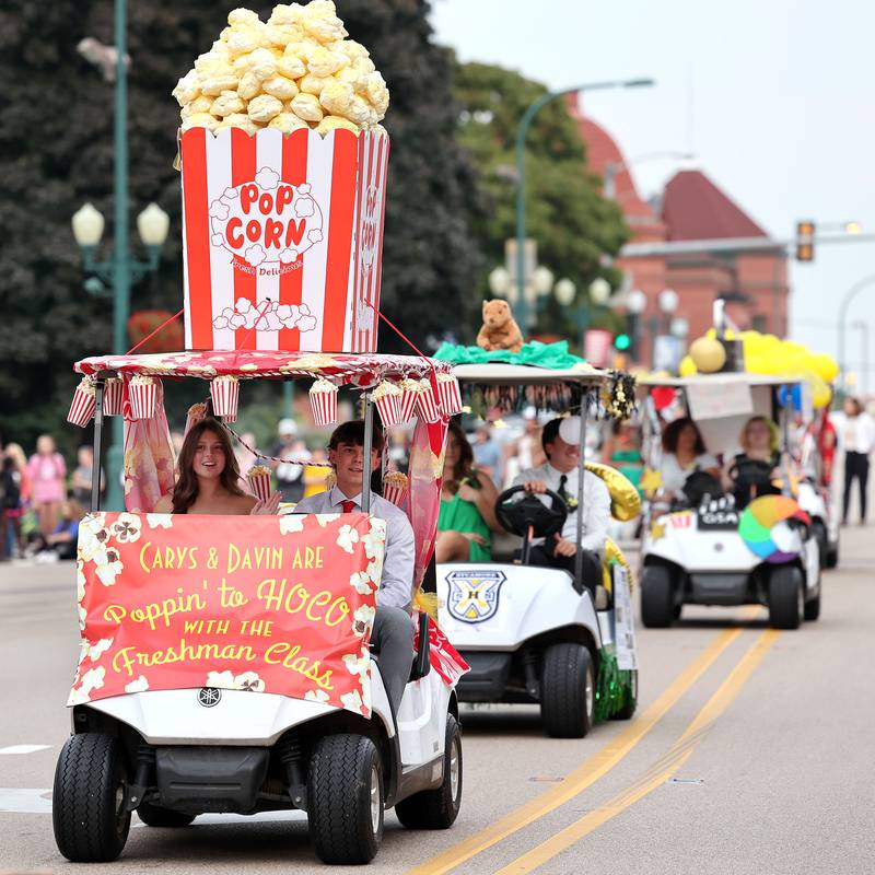 Some of the Sycamore High School club decorated golf carts make their way down State Street Wednesday, Sept. 20, 2023, during the Sycamore High School homecoming parade.