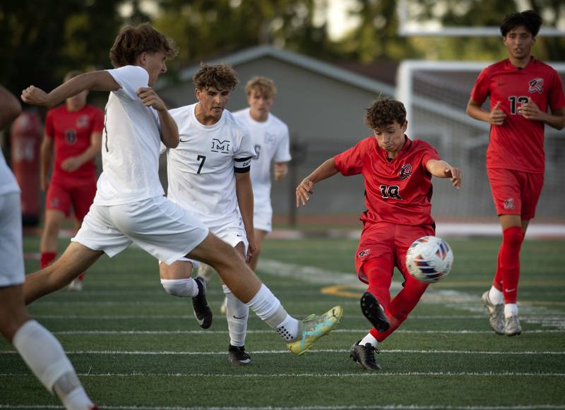 Bradley-Bourbonnais' Francisco Adrian gets a shot on goal as a Minooka player misses getting a foot on the ball in a game on Tuesday, August 26, 2025.