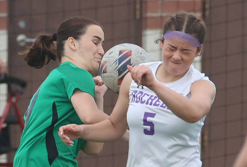 L-P's Clare Domyancich and Rochelle's Abby Dougherty knock down the ball as it falls into play on Wednesday, April 15, 2026 at the L-P Athletic Complex in La Salle.