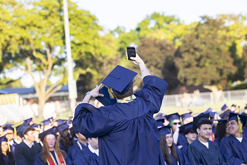 Benjamin Gomer snaps a selfie after getting his diploma from Sterling High School Friday, May 26, 2023.