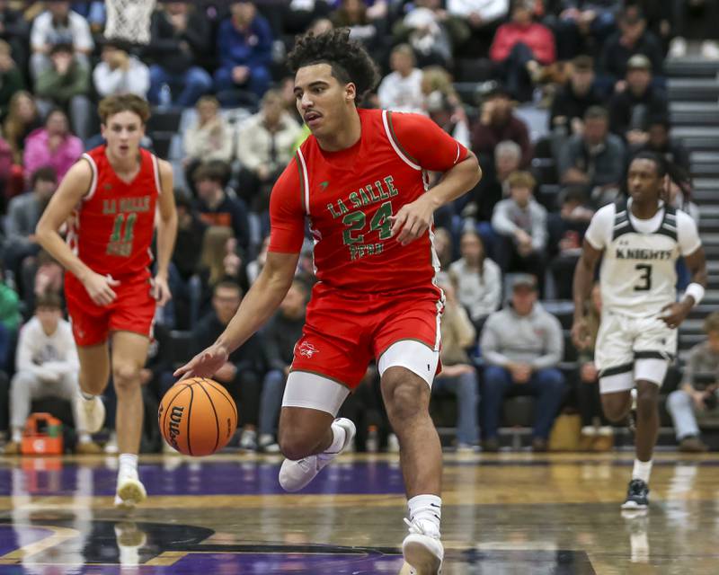 LaSalle Peru's Marion Persich (24) advances the ball down court during their Plano Christmas Classic semi-final basketball game between Kaneland at LaSalle Peru Monday, Dec 29, 2025 in Plano.