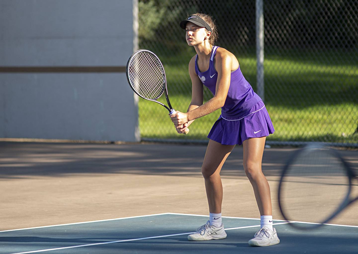 Dixon’s Leah Stees waits for the serve Thursday, Sept. 29, 2022 while playing doubles against Sterling.