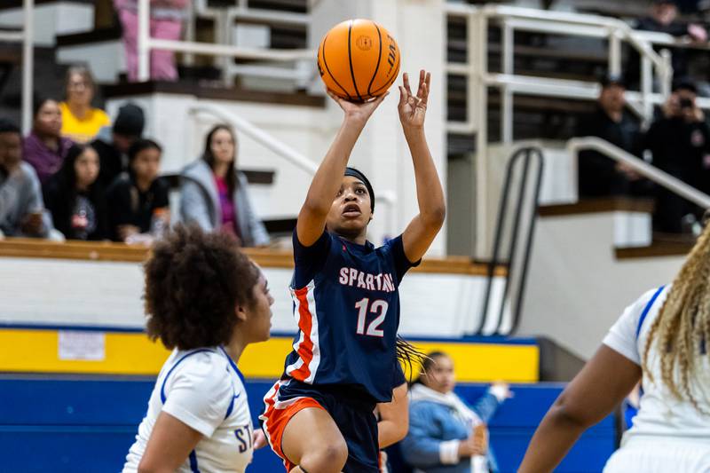 Romeoville's Aaliyah Adams takes a shot during a varsity girls basketball game against Joliet Central at Joliet Central on Dec. 18, 2025.