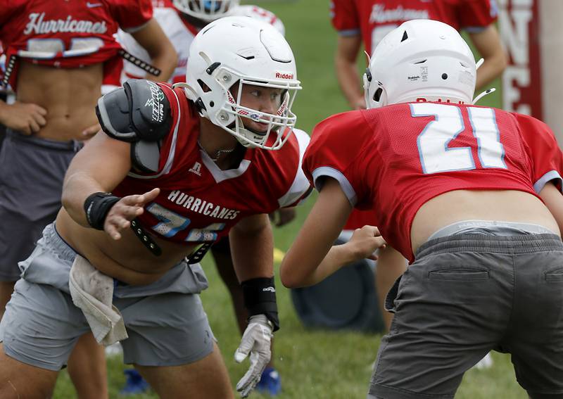 Marian Central’s Matt Conlon rushes during a defensive drill during football practice on Tuesday, August 19, 2025, at Marian Central  High School in Woodstock.