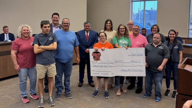 Rhythm & BBQ donates $20,000 to Illinois Valley Industries