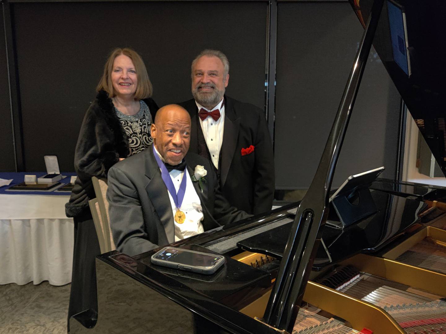 Huntley Brown entertains at Fox Valley Arts Hall of Fame gala. In back is operatic tenor Frank Martorana.