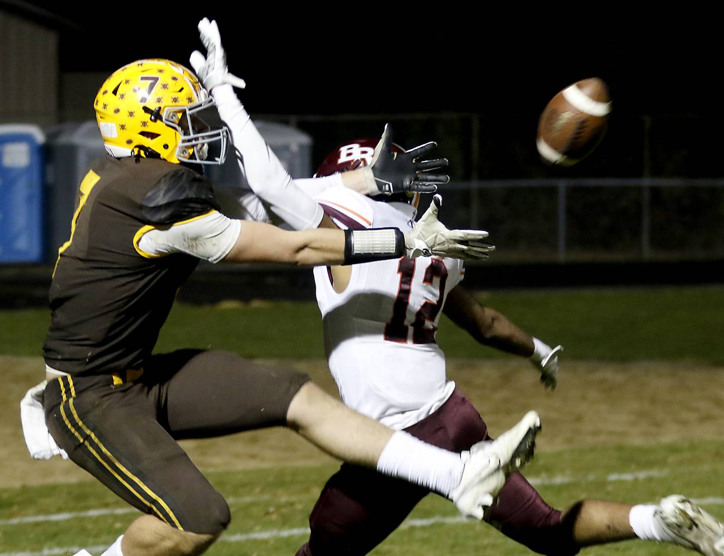 Jacobs' Grant Stec tries to catch the ball as he is defended by Brother Rice's Sidney Green during a IHSA Class 7A first round playoff football game Friday, Oct. 28, 2022, between Jacobs and Brother Rice at Jacobs High School in Algonquin.
