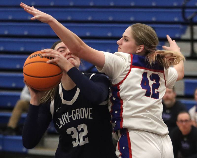 Cary-Grove’s Olivia Leuze, left, battles against Lakes’ Olivia Lamb in varsity girls basketball action on Friday, Jan. 2, 2026  at Lakes High School in Lake Villa.