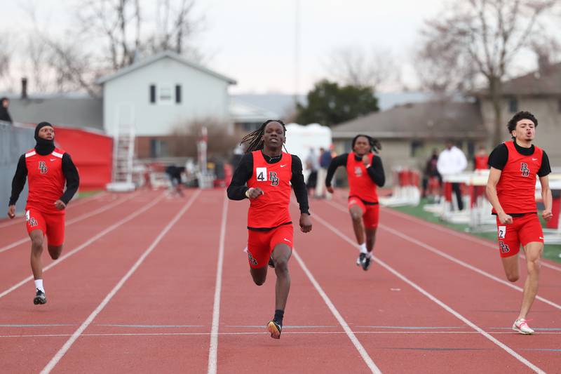 Momence's LyZale Edmon, center, finishes in first just ahead of teammate Kyron Birk, right, in the 100-meter dash during the Boilermaker Invite on Thursday, April 3, 2025. Wright would take third overall.