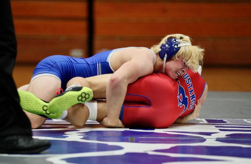 Princeton's Casey Etheridge gets a good grip against Morrison's Brady Anderson Thursday night at Prouty Gym.