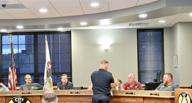 School Resource Officer Brian Zebron takes Haven to meet each of Peru City council members and public officials during Monday, May 7, 2024 council meeting.