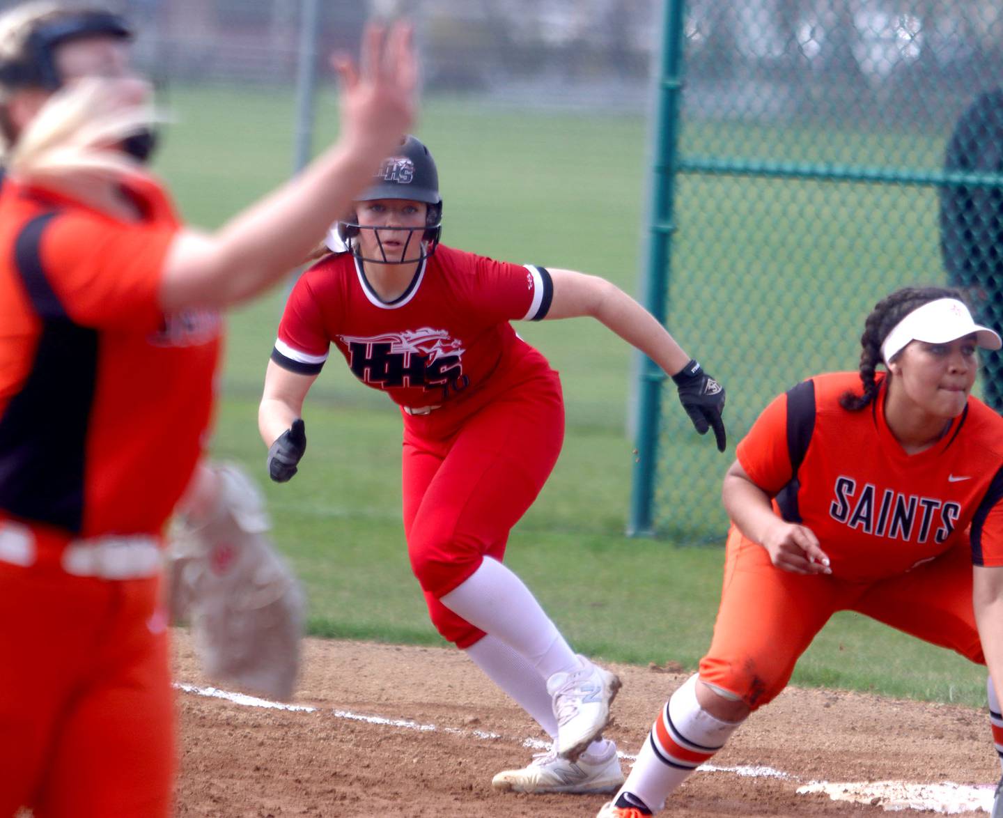 Huntley’s Meghan Ryan gets a lead off of first base against St. Charles East during varsity softball at Marengo Saturday morning.