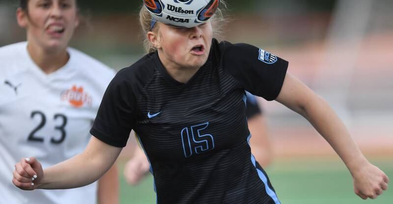 John Starks/jstarks@dailyherald.com
St. Charles North’s Lauren Balster heads the ball against Wheaton Warrenville South in the St. Charles East girls soccer sectional semifinal game on Tuesday, May 24, 2022.