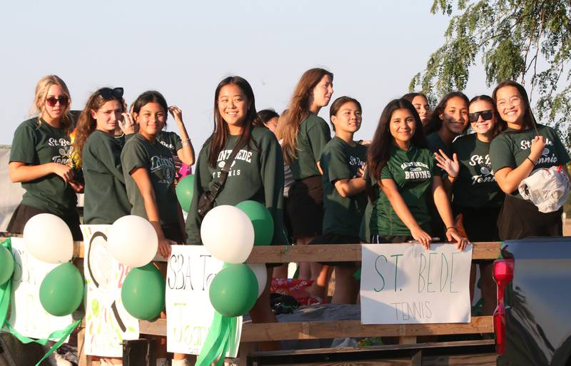 Members of the Lady Bruin tennis team ride in the St. Bede Homecoming Parade on Friday, Sept. 29, 2023 at St. Bede Lane.