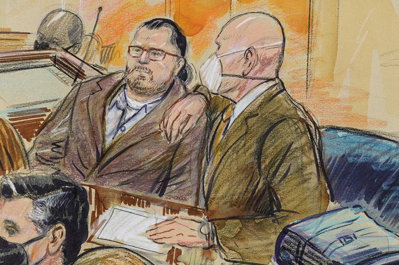 FILE - This artist sketch depicts Guy Wesley Reffitt, joined by his lawyer William Welch, right, in Federal Court, in Washington, on Feb. 28, 2022.  Reffitt, convicted of storming the U.S. Capitol with a holstered handgun helmet and body armor was sentenced on Monday to 87 months — more than seven years — in prison. It's the longest sentence imposed so far among hundreds of Capitol riot cases. (Dana Verkouteren via AP, File)