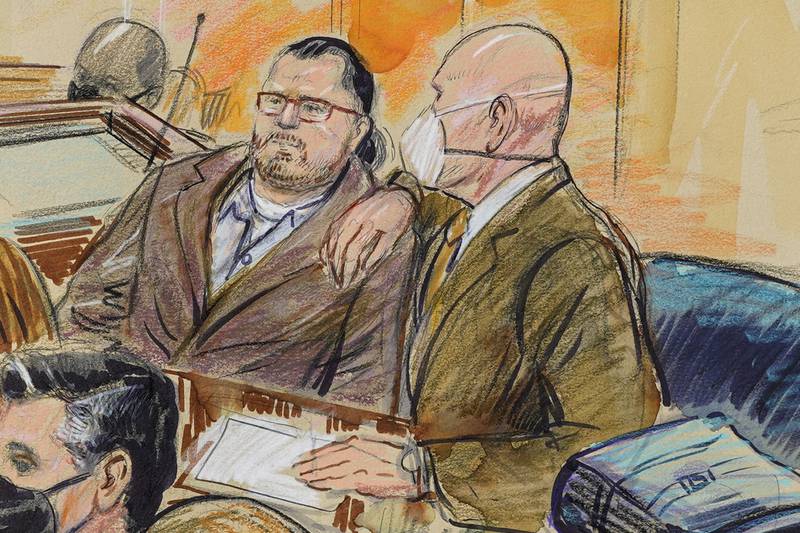 FILE - This artist sketch depicts Guy Wesley Reffitt, joined by his lawyer William Welch, right, in Federal Court, in Washington, on Feb. 28, 2022.  Reffitt, convicted of storming the U.S. Capitol with a holstered handgun helmet and body armor was sentenced on Monday to 87 months — more than seven years — in prison. It's the longest sentence imposed so far among hundreds of Capitol riot cases. (Dana Verkouteren via AP, File)