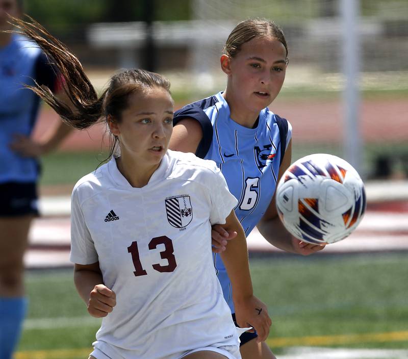 St. Ignatius College Prep's Lili Garcia battles with Nazareth Academy's Gwen Passino for control of the ball during a IHSA Class 2A State Girls Soccer semifinal match on Friday, June 6, 2025, at North Central College in Naperville.