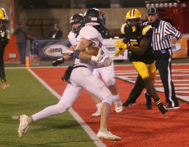 Rochester's Henry Buecker steps into the end zone to score a touchdown against St. Laurence during the Class 4A State football championship on Friday, Nov, 24, 2023 at Hancock Stadium in Normal.