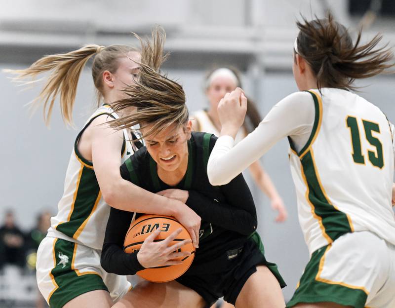 Glenbard West's Hannah Roberts, right, draws hard contact from Fremd's Sophia McMillan during the Hersey Class 4A supersectional at Forest View Education Center on Monday, March 3, 2025 in Arlington Heights.