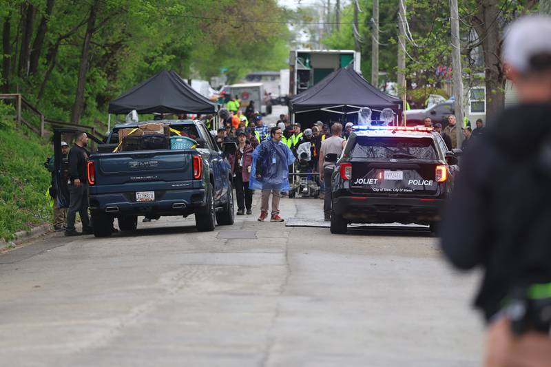 Film crews work along the 500 block of North Bluff street on Monday, April 27, 2026 in Joliet. HBO began filming the pilot for “American Blue” that follows a police chief retuning to Joliet to take over the police department.