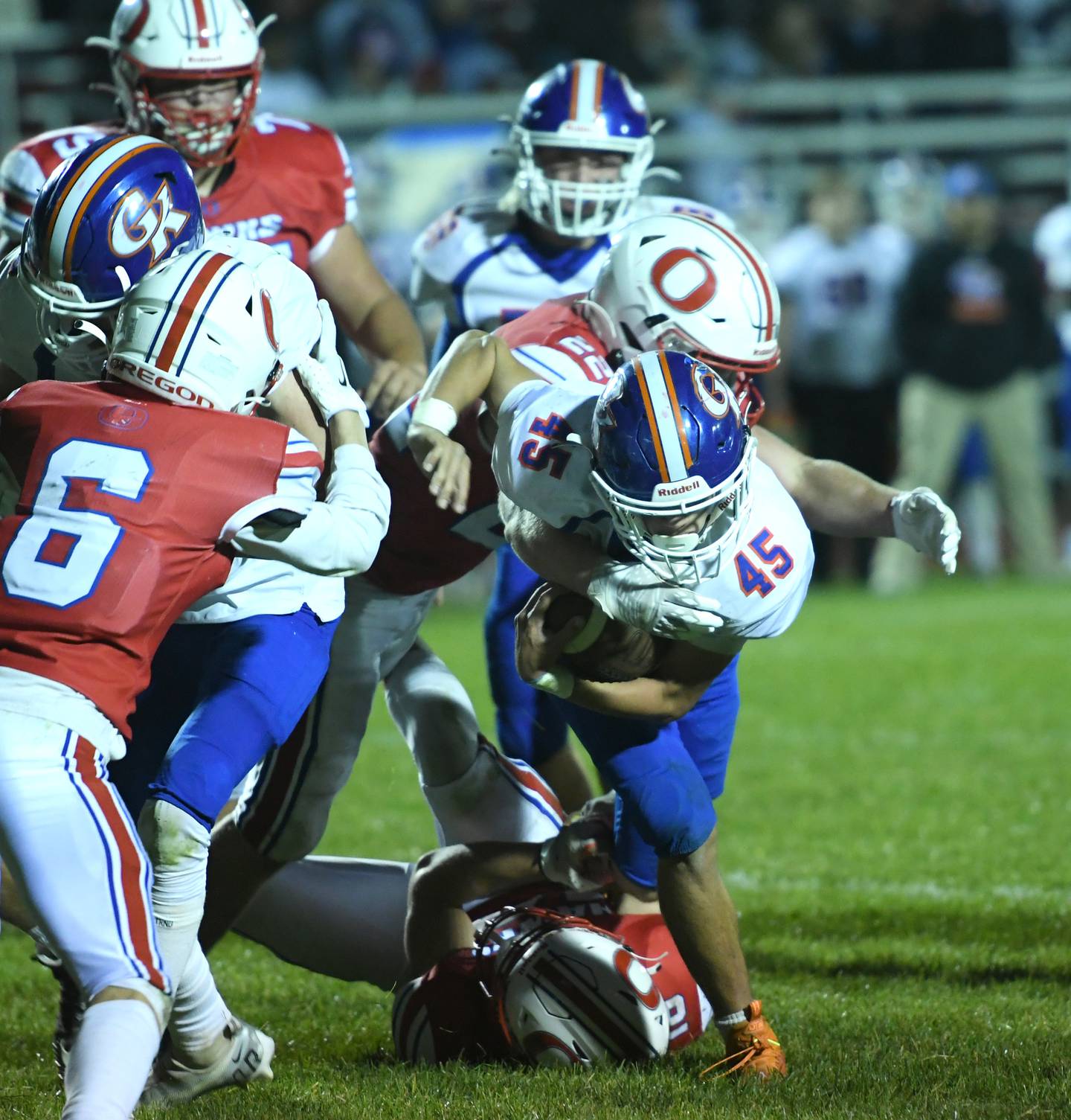 Genoa-Kingston's Maddox Lavender fights for yards against Oregon during Friday, Sept. 30 action at Landers-Loomis Field.