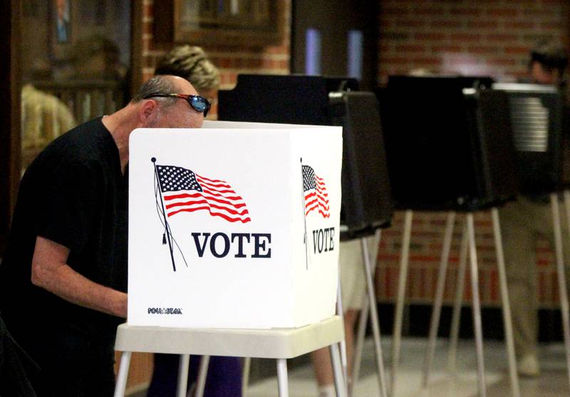 Dr. Jeffrey Bernier votes in the General Primary Election at Downers Grove North High School on Tuesday, June 28, 2022.