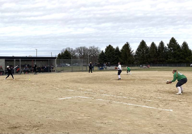 Woodland/Flanagan-Cornell leadoff batter Olivia Chismarick hits a groundball off Seneca pitcher Taya Roe to waiting first baseman Madi Mino for a 3-4 putout in the sixth inning Tuesday, March 29, 2022, in rural Streator.