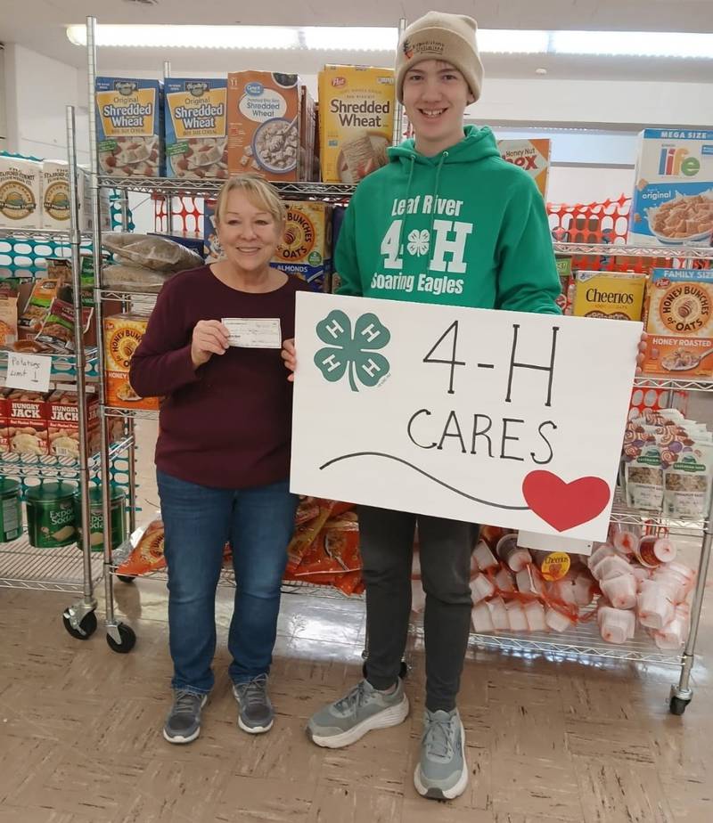 Pictured are David Wehler and Barb Diehl, pantry director at Loaves and Fish Food Pantry.