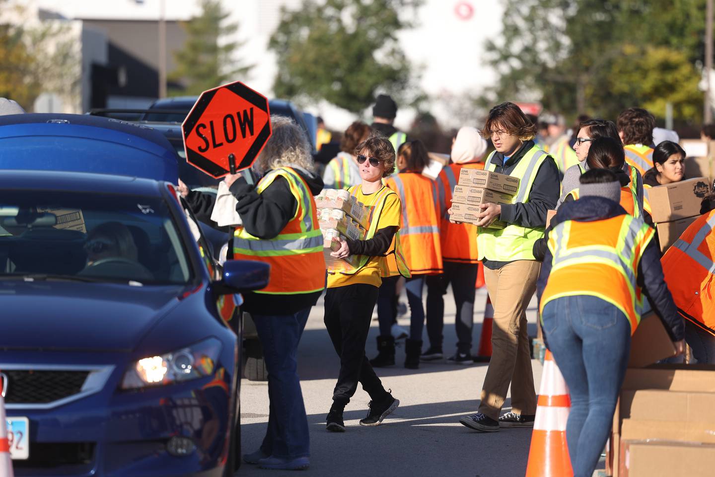 Volunteers load groceries into cars at Joliet Junior College on Saturday, Oct. 21. With inflation and rising food costs, Northern Illinois Food Bank held a Free PopUp Grocery Distribution giving away groceries to 700 families.