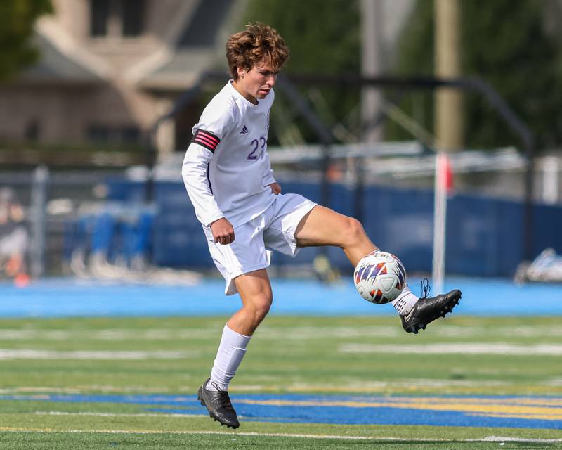 Downers Grove North's Ryan Wilson (23) handles the ball during Class 3A Lyons Regional final soccer match.  Oct 21, 2023.