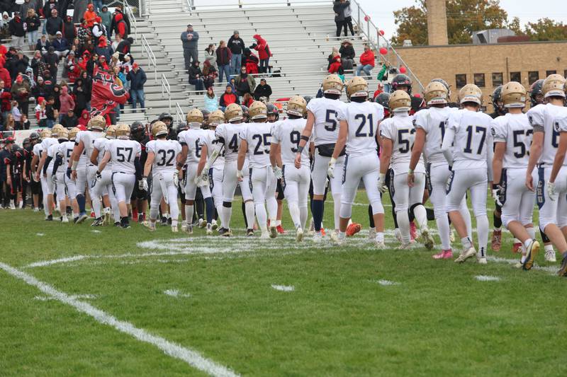 Members of the Marquette football team walk off the field after being defeated during the Class 1A playoff game on Saturday, Nov. 1, 2025 at Gibson City-Melvin-Sibley High School.