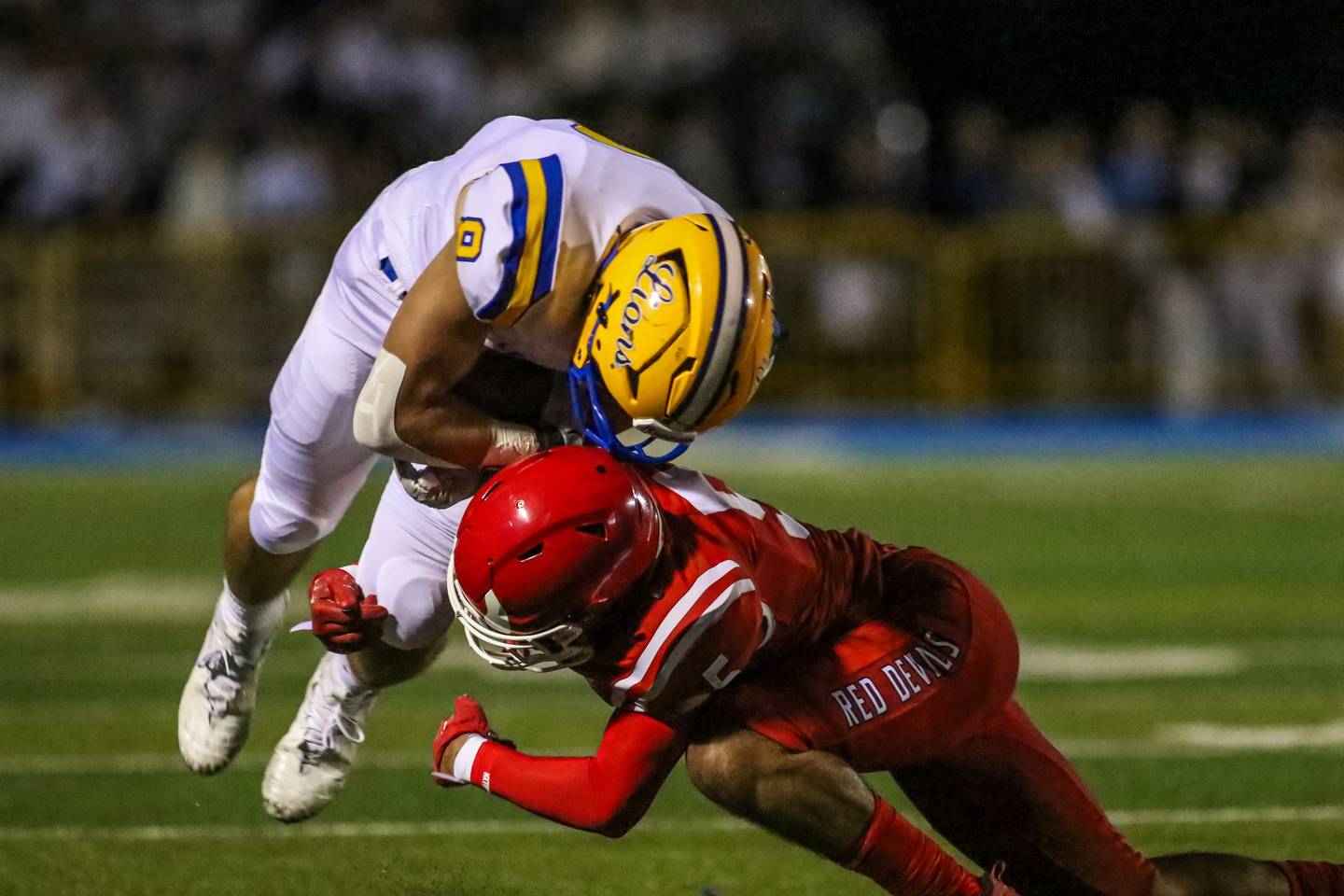 Lyon's Luke Wehling (8) is tackled by Hinsdale Central's Carter Contreras (5) during football game between Hinsdale Central at Lyons.  Sept 8, 2023.