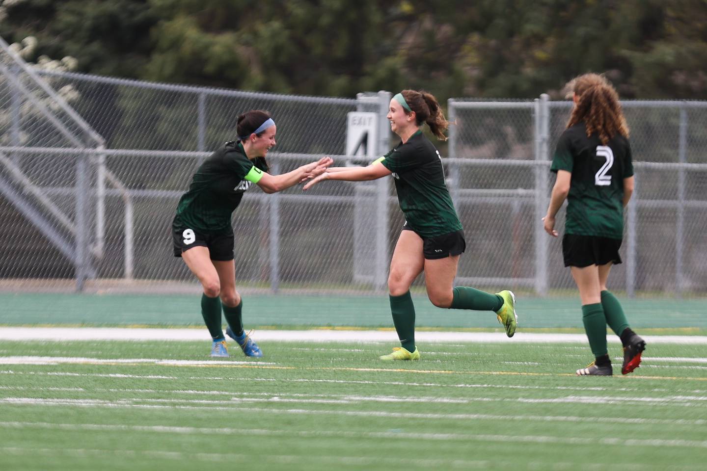 Plainfield Central’s Piper Woodall (9) congratulates Jenny Brooks on her goal against Plainfield East. Friday, April 29, 2022, in Plainfield.