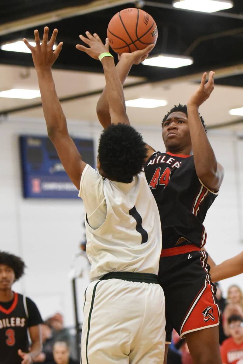 Bradley-Bourbonnais' Jeremiah Jones, right, takes a shot while Vaughn/St. Patrick's Pierre Brown defends during the IHSA Class 2A Special Olympics Unified State championship game at the University of Illinois Activities and Recreation Center Saturday, March 14, 2026.