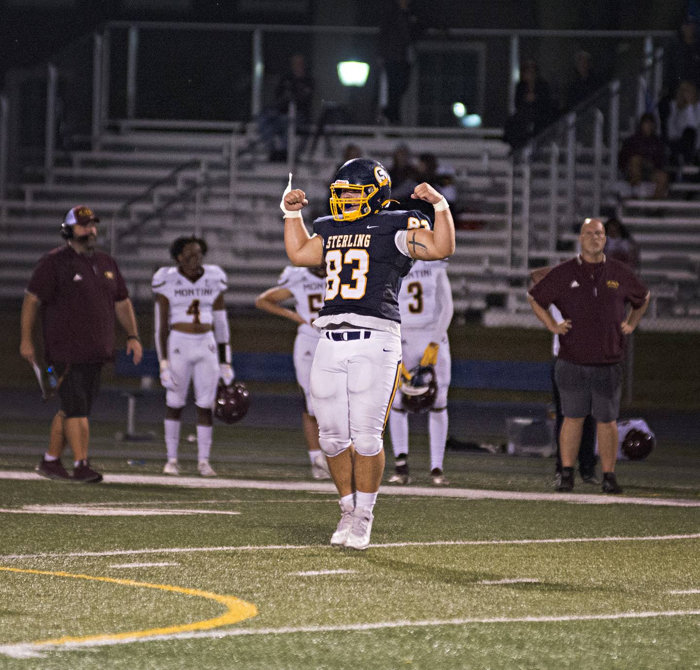 Sterling's Jason Farnham celebrates a tackle for a loss Friday, September 3, 2021 as the Warriors host the Montini Broncos for their first home game of the season.