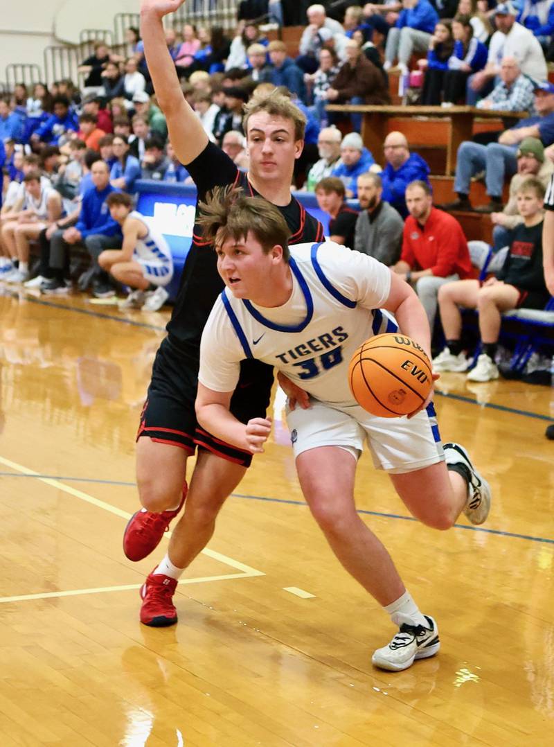 Princeton senior Jordan Reinhardt drives against Erie-Prophetstown Friday night at Prouty Gym. the Tigers won 60-37.