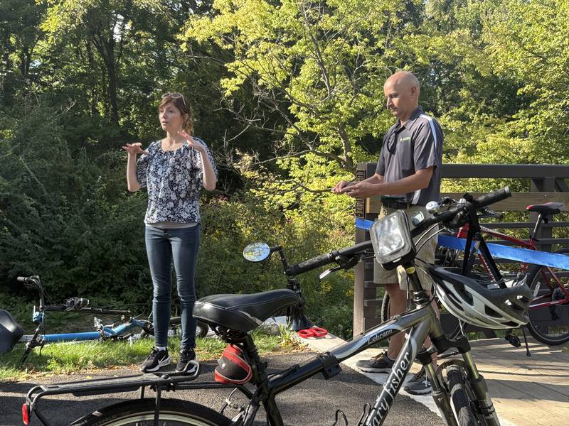 Sue Stillwell (left), president of the Village of Sugar Grove, speaks during a ribbon cutting for the Bridge at Belle Vue Park on Sept. 5, 2025, in Sugar Grove.