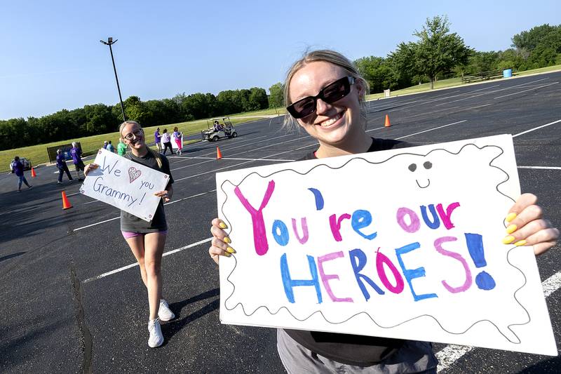 Sisters Sydnie (left) and Whitnie Garriott of Sterling celebrate their grandmother Mary Chriest and others Saturday, June 14, 2025, during the survivors lap at the 30th Relay for Life of the Sauk Valley held at Westwood in Sterling.