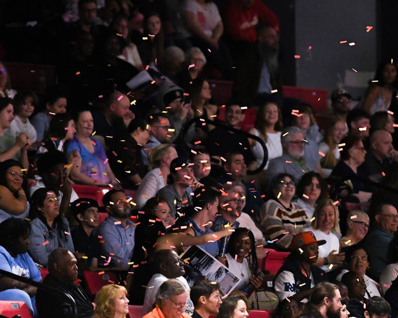 Confetti falls to the ground after a confetti popper was popped during the DeKalb High School graduation ceremony on Saturday May 23, 2026, held at the Convocation Center in DeKalb.
