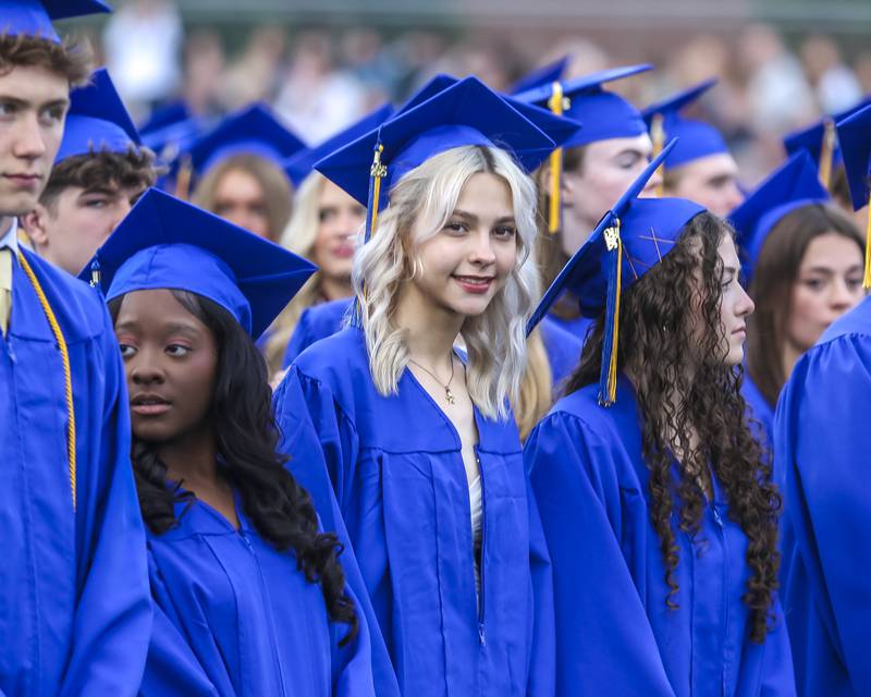 Students stand at the Lyons Township High School Graduation ceremony Wednesday, May 28, 2025  in Western Springs.