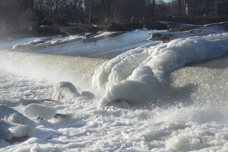 Ice forms on a tree trunk in the Rock River at the Oregon dam on Tuesday, Jan. 14, 2025. The cold temperatures are forecast to last through the week.