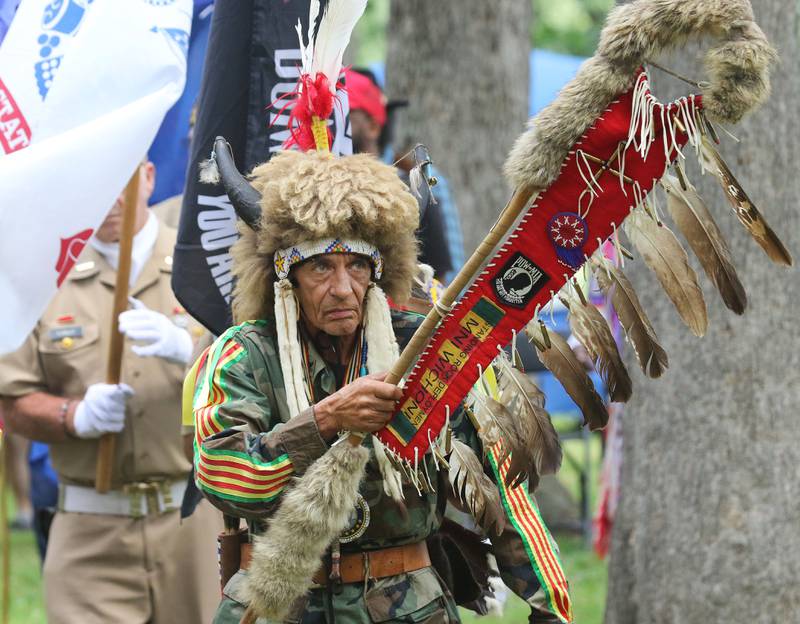 Wamblee Loux, of Vermillion, SD., a U.S. Navy veteran and member of the Oglala Lakota Tribe walks in the Grand Entry during the 30th Annual Potawatami Trails Pow-Wow at Shiloh Park on Saturday, August 26th in Zion. 
Photo by Candace H. Johnson for Shaw Local News Network