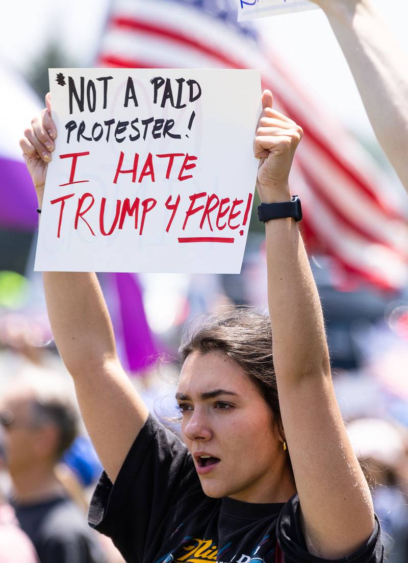 Madeline LaPorte of Bartlett protests during a “No Kings Day” Protest against President Donald Trump’s policies along South Randall Road in Geneva on Saturday, June 14, 2025.